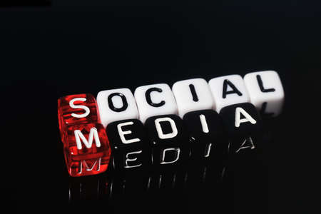 Social Media on red black  and  white  dices on  black  backgroundの写真素材