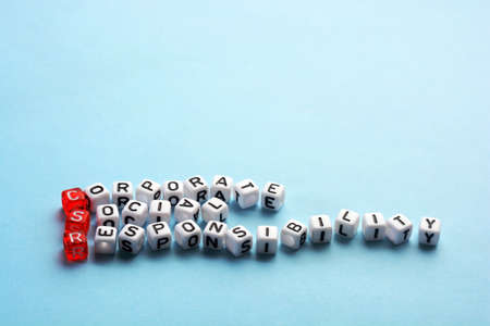 CSR Corporate Social Responsibility acronym on cubes on blue backgroundの写真素材