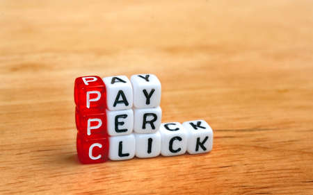 PPC Pay Per Click text on  dices on wooden background