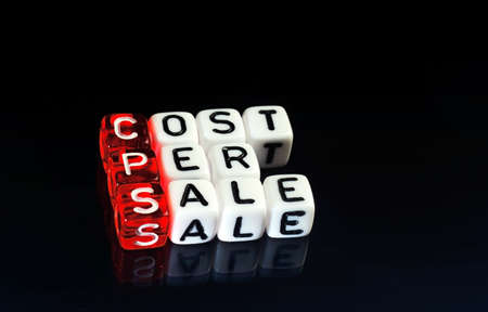 CPS Cost Per Sale written on dices on black  backgroundの写真素材