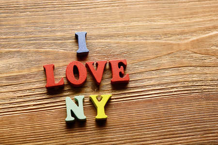 I LOVE NY- word made from multicolored   letters on wooden  background warm colorの写真素材
