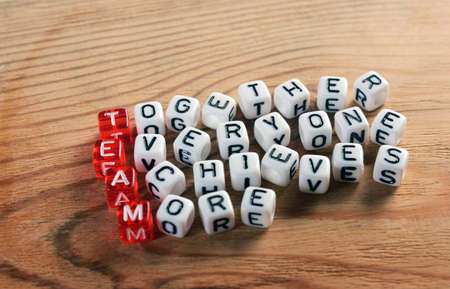 acronym of  TEAM  red and  dices on woodの写真素材