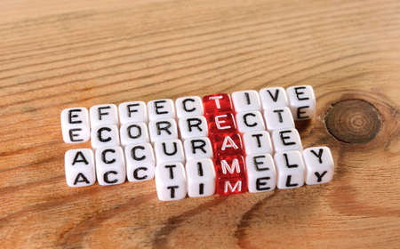 acronym of  TEAM  red and  dices on wood