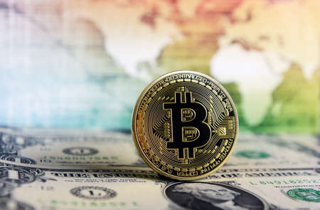 Bitcoin currency on a world map  background on  dollar billのeditorial素材