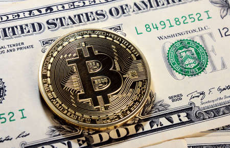 Bitcoin on one  dollar banknote. Trading concept .のeditorial素材