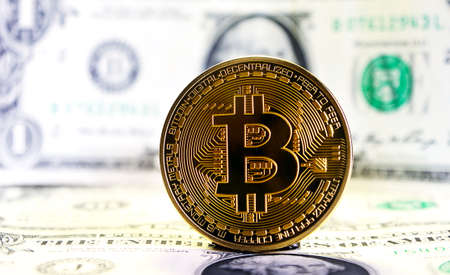 Bitcoin currency on background on  dollar billのeditorial素材