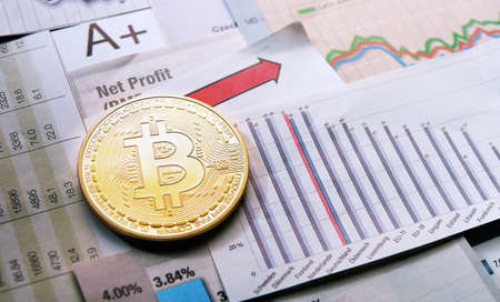 A golden bitcoin on graph and diagrams  background. concept of trading  crypto currencyのeditorial素材