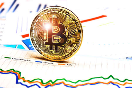 A golden bitcoin on graph and diagrams  background. concept of trading  crypto currencyのeditorial素材