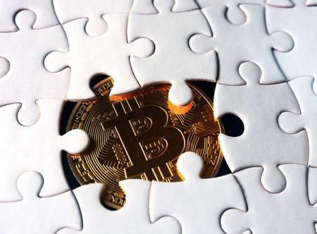 bitcoin coin under puzzleの写真素材