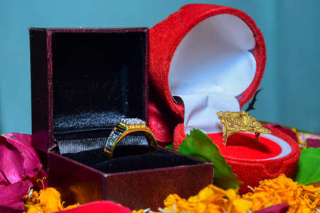 Bride Groom engagement rings are kept on a decorated table.の写真素材