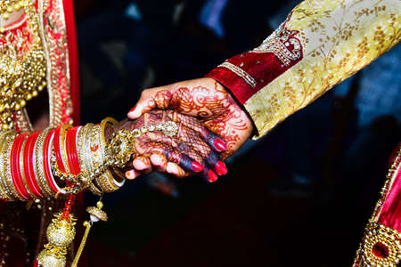 The groom hold hands of bride to come up on the stairs stage, wedding palace during wedding ceremony.  top view. Weddingの写真素材