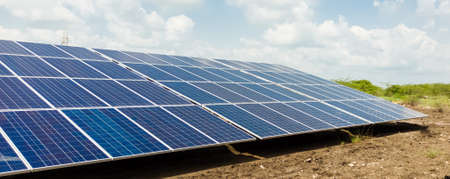 Installed Photovoltaic solar panels / modules at solar power station. Clear sky sunny day clear closeup view.の写真素材