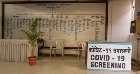 Aurangabad, Maharashtra, India-03/23/2021- COVID 19 test facility arrangement desk at district magistrate/collector office for visitors.のeditorial素材