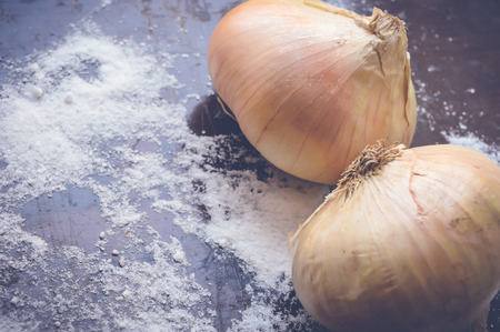 onions on wooden tableの写真素材