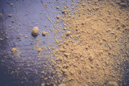 ginger poweder on wooden table background textureの写真素材
