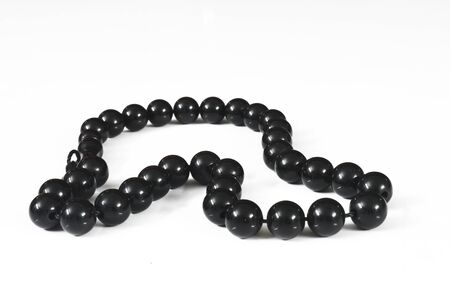 black beads isolated on whiteの写真素材