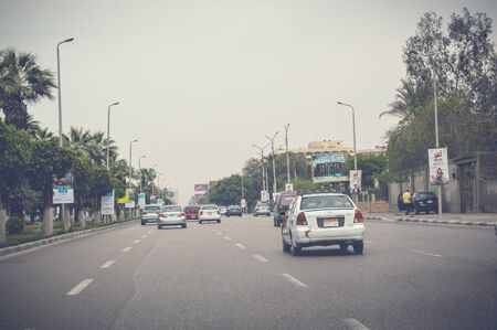 cairo, egypt, may 6, 2017: view of highway traffic at cairo ismaileya desert roadのeditorial素材