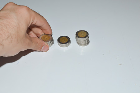hand on stacked coins, finanical concept