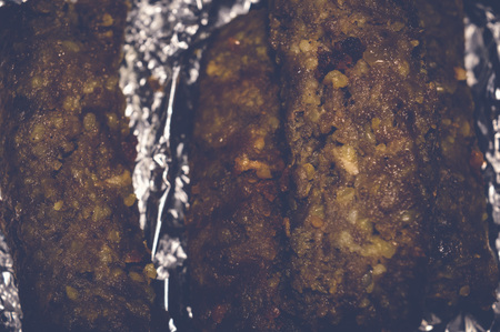 kofta kebabs on aluminum foil paperの写真素材