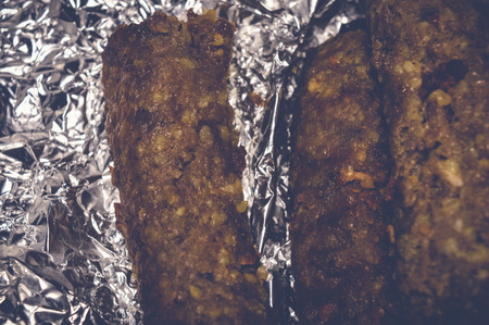 kofta kebabs on aluminum foil paperの写真素材