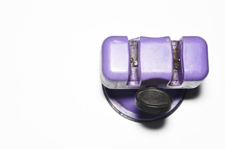 old dirty knife sharpener isolated on whiteの写真素材