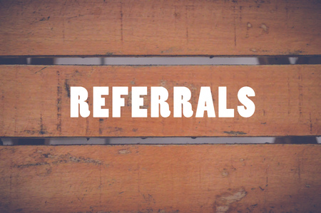 referrals written on wooden table, technology concept backgroundの写真素材