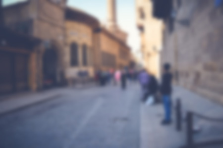 blurred background of people walking in the streetの写真素材