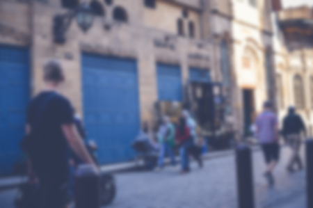 blurred background of people walking in the streetの写真素材