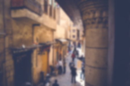 blurred background of people walking in the streetの写真素材