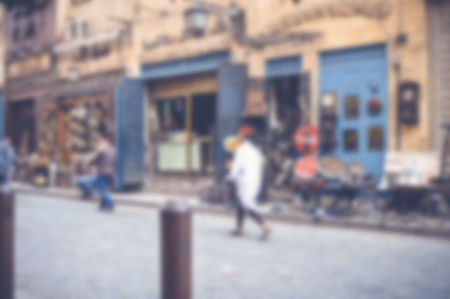 blurred background of people walking in the streetの写真素材