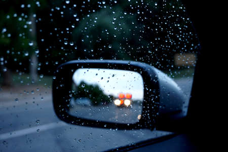 Emergency service vehicle at car side mirrorの写真素材