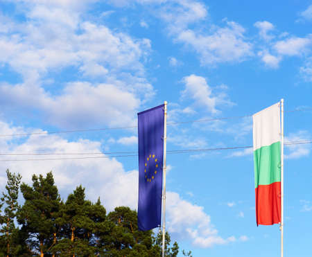 Flags and blue sky background.