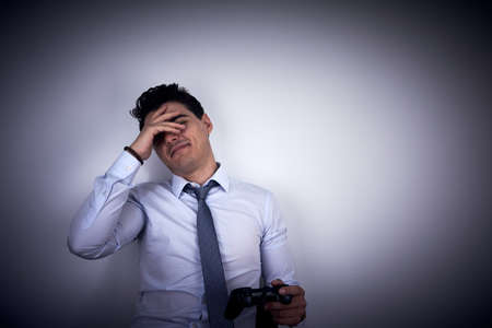 Businessman loosing on video gameの写真素材