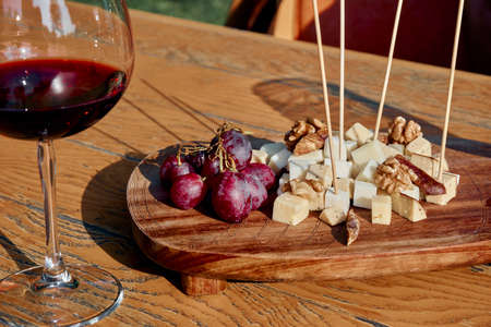 Glass Of Fine Red Wine With Grape and Cheeseの写真素材