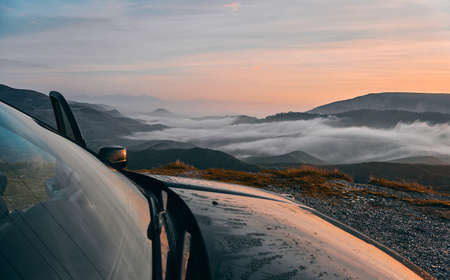 Off Road Adventure at Sunrise and Beautiful Clouds over the Montainsの写真素材
