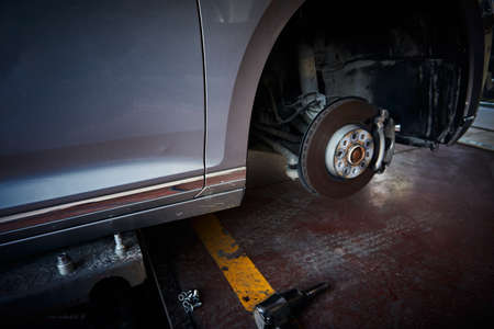 Car brake disk and tyre change at a car repair shop