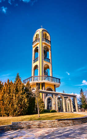 The bell tower of Haskovo next to the Monument of Virgin Mary