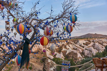 Evil eye charms hanging on a treeの写真素材