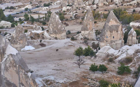 Ancient cave houses  and rock formations near Goreme, Cappadocia, Turkeyのeditorial素材