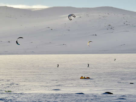 Buskerud, Norway - January 22, 2017: People enjoying snowkiting on a sunny winter day. Buskerud is part of the National Park Hardangervidda.のeditorial素材