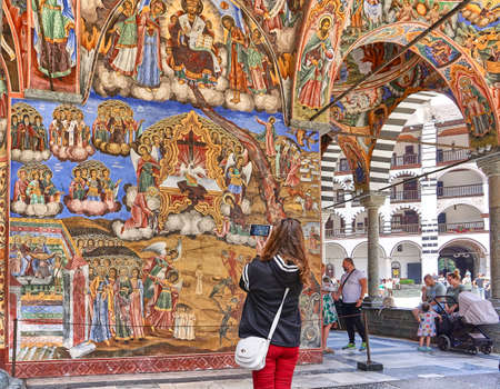 Rila, Bulgaria - July, 23, 2017: Tourist taking photos at the church in Unesco World Heritage site...