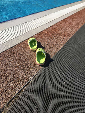 Green pool sleepers next to the pool