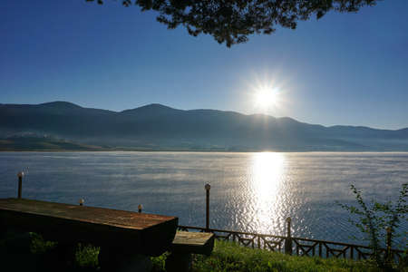 Sunrise over the mountain with reflection on the lakeの写真素材