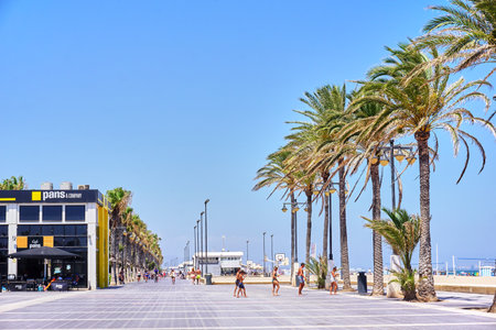 Valencia, Spain - July 27, 2017:  El Cabanyal beach  in Valencia, Spain. Tourists and locals can be seen on the beachfront.のeditorial素材