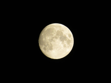 Full moon on black backgroundの写真素材