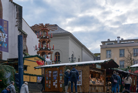 Basel, Switzerland - December 10, 2025: People stroll through the old town, home to the cityâs two charming Christmas markets, as locals and tourists enjoy the festive seasonのeditorial素材
