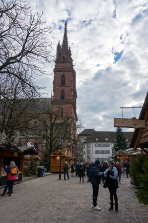 Basel, Switzerland - December 10, 2025: People stroll through the old town, home to the cityâs two charming Christmas markets, as locals and tourists enjoy the festive seasonのeditorial素材