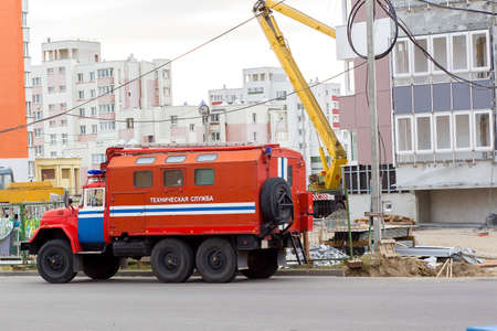 fire truck with the words "technical service" in Russian near a house under constructionのeditorial素材