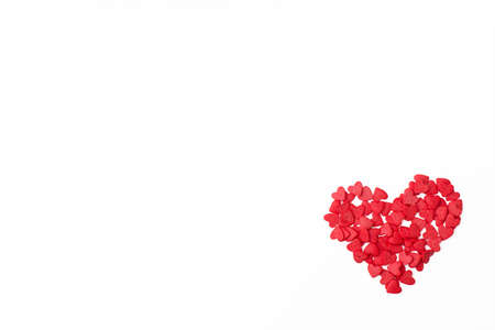 a small red heart on a white background. romantic love background for Valentine's day, birthday, holiday, party, weddingの写真素材