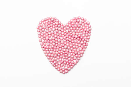 pink heart sprinkles on a white background. romantic love background for Valentine's day, birthday, holiday, party, wedding.の写真素材
